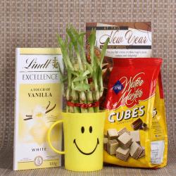 Send New Year Gift New Year Good Luck Gift of Lindt Chocolate and Wafer Cubes To Chandigarh