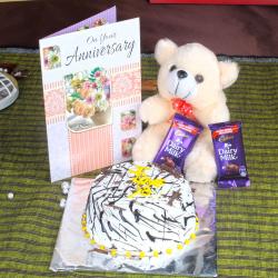 Send Anniversary Eggless Vanilla Cake with Greeting Card and Dairy Milk Chocolates To Karaikudi