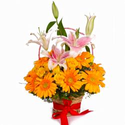 Exotic Flowers Arrangement - Basket of Yellow Gerberas, Roses and Pink Lilies