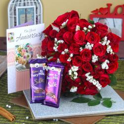 Send Red Roses Hand Bunch and Anniversary Greeting Card with Silk Chocolate To Dahod