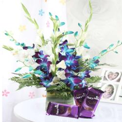 Glass Vase of Mix Orchids with Cadbury Chocolates
