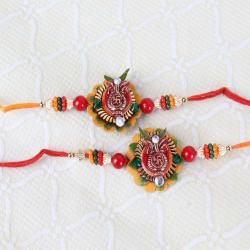 Divine Rakhis - Set of Two Swastika Kalash Floral Rakhi