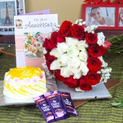 Send Anniversary Mix Roses Hand Tied Bouquet with Fresh Pineapple Cake and Dairy Milk Chocolates To West Godavari