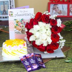 Send Anniversary Mix Roses Hand Tied Bouquet with Fresh Pineapple Cake and Dairy Milk Chocolates To Dharwad