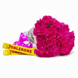 Send Bhai Dooj Gift Elegant Bouquet of Pink Carnations with Toblerone Chocolate Bars To Rajsamand