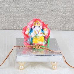 Ganesh Chaturthi - Floral Ganesha Idol with Rakhi