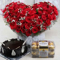 Anniversary Trending Gifts - Attractive Roses Arrangement with Chocolate Cake and Ferrero Rocher Box
