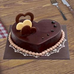 Anniversary Exclusive Gift Hampers - One Kg Eggless Heart Shape Chocolate Cake