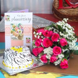 Send Anniversary Vanilla Cake with Greeting Card and Twelve Red Roses Bouquet To Mussoorie