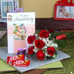 Send Six Red Roses Hand Bunch and Assorted Chocolates with Anniversary Greeting Card To Baroda