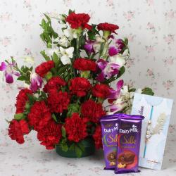 Send Rakhi Gift Assorted Flowers Arrangement with Chocolate and Rakhi To Delhi