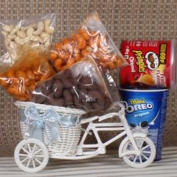 Send Chocolates Gift Cycle Basket of Dryfruits and Oreo Pringles  To Kupwara