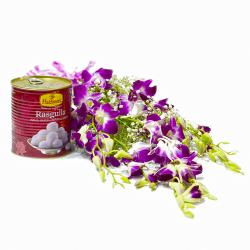 Send Six Purple Orchids Bouquet with Rasgullas Tin To Delhi