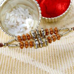 Send Rakhi Gift Diamond Rings and Golden Strings Rakhi To Bhopal