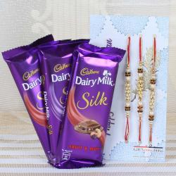 Kundan Rakhis - Cadbury Dairy Milk Silk Chocolate and Set of Three Rakhi