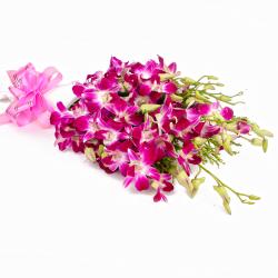 Send Exotic Bouquet of 10 Purple Orchids with Tissue Wrapping To Mumbai
