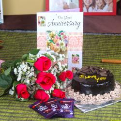 Send Anniversary Roses with Cake and Chocolate Bars To Navsari