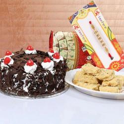 Premium Rakhis - Half Kg Black Forest Cake with 500 Gms Soan Papdi and Rakhi