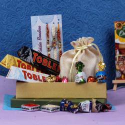 Send Rakhi Gift Three Fancy Rakhi With Toblerone and Truffle Chocolates To Jaipur