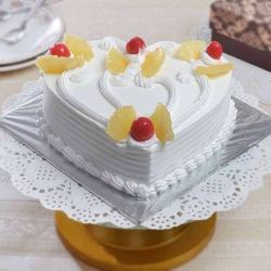 Send Valentines Day Gift One Kg Heart Shape Pineapple Cake Treat To Jaipur