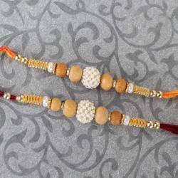 Set Of 2 Rakhis - Two Pearl Rhinestone and Wooden Beads Rakhi