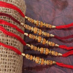 Set Of 5 Rakhis - Luminous Diamond Ring with Wooden Beads Rakhi Combo