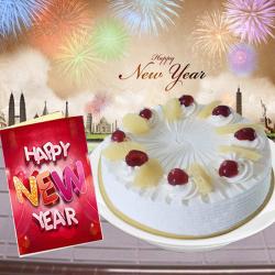 Send New Year Gift New Year Greeting Card and Round Eggless Pineapple Cake To Amritsar