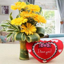 Anniversary Gifts Gender Wise - Heart Shaped Small Cushion with Gerberas in Vase