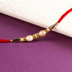 Stone Rakhis - Ellipse Shape Pearl Rakhi